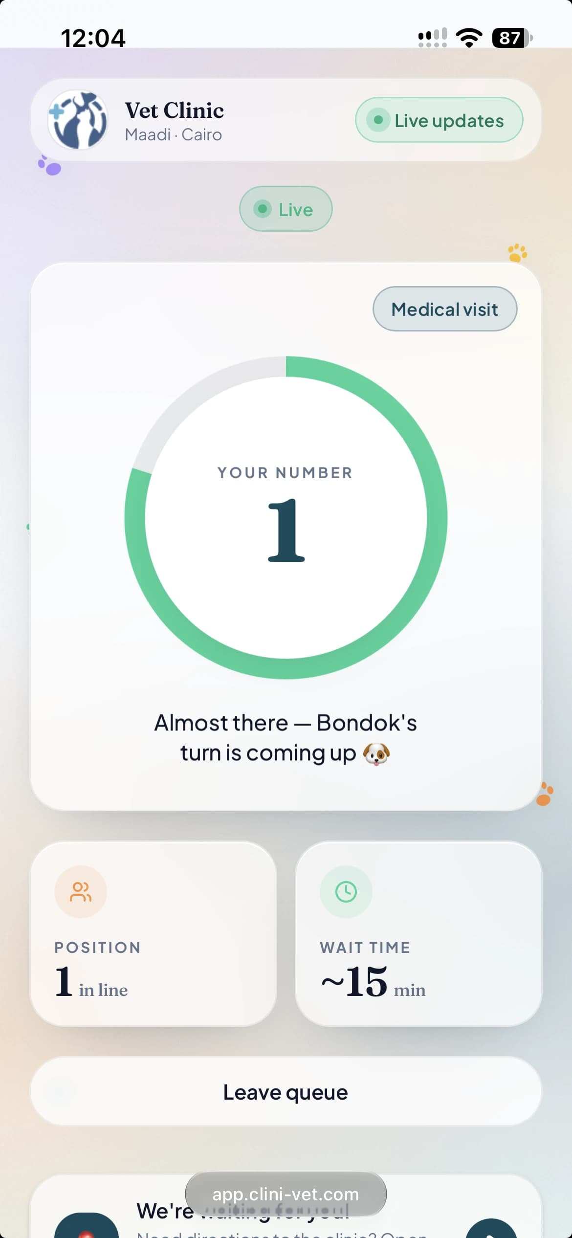 A pet owner tracking their place in the live queue from their phone browser